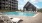 The pool area at our apartments for rent in Sachse, TX, featuring beach chairs and a view of the club house.